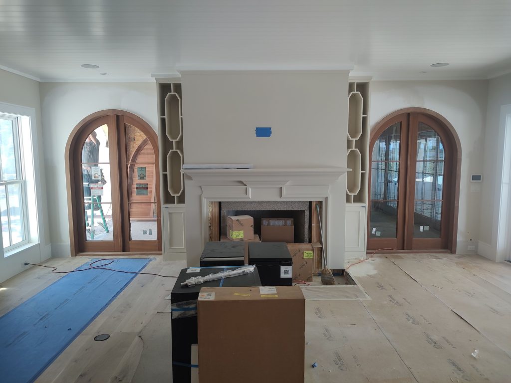 custom fireplace mantle with arched doors on each side